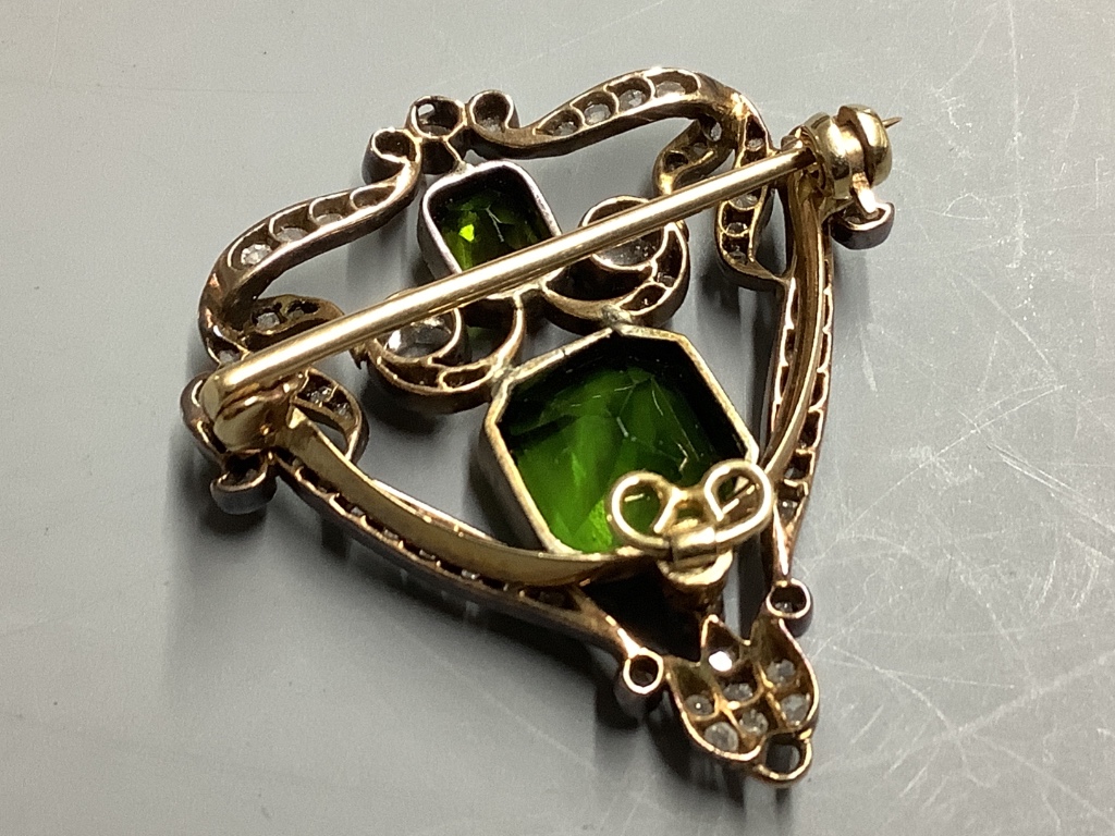 A Victorian gold and silver openwork pendant-cum-brooch set with rose-cut diamonds and emerald cut green paste, H 35mm